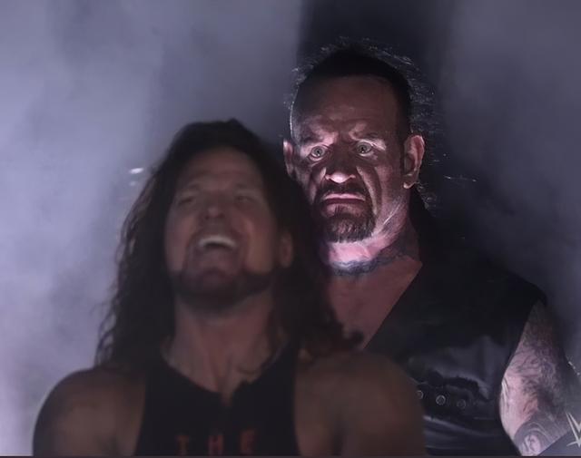 Undertaker Standing Behind AJ Styles meme template blank
